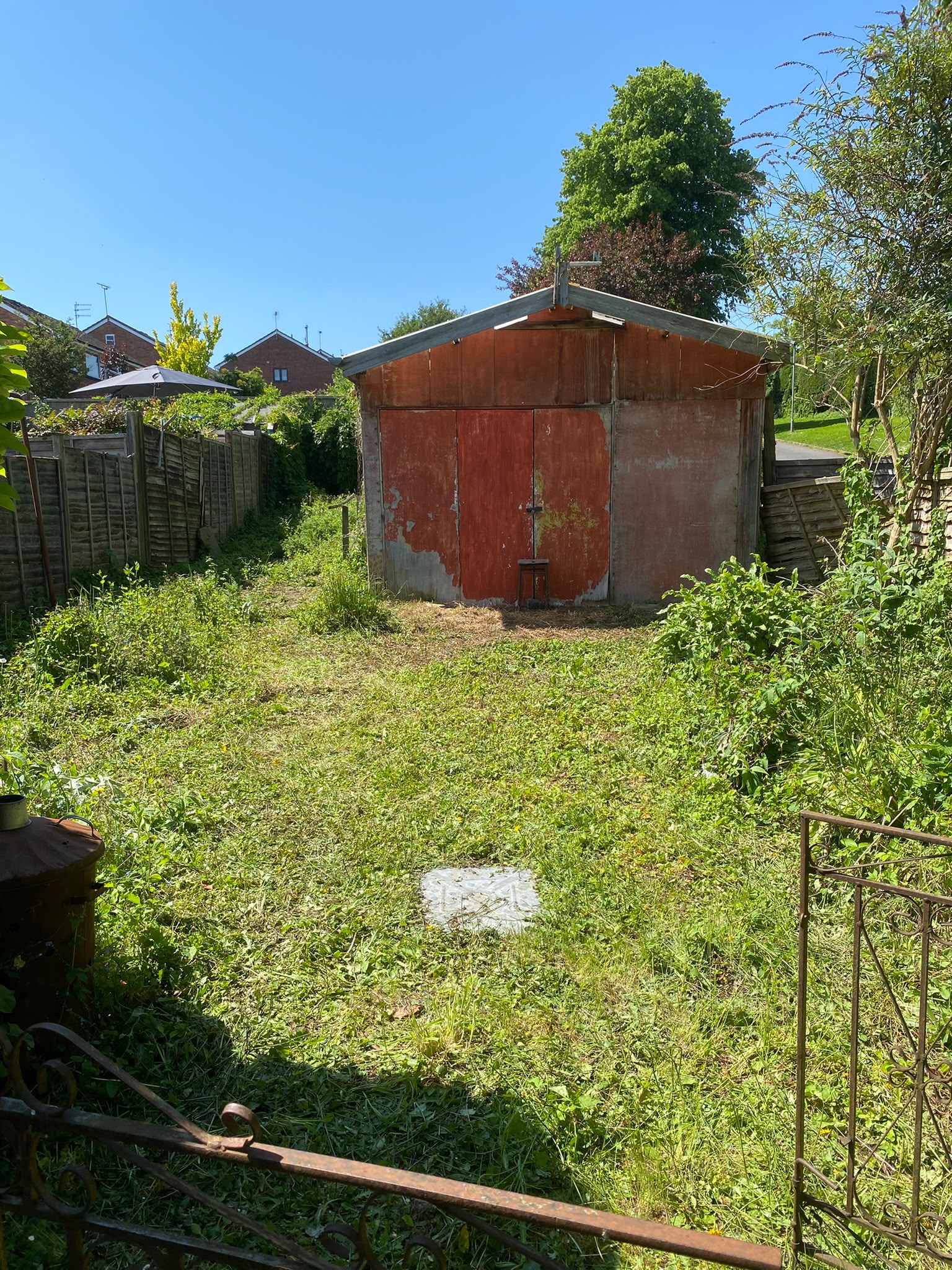 Original garden and outbuilding before construction